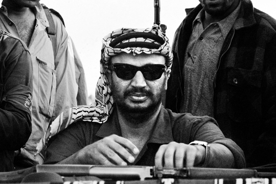 The Palestine Liberation Organization (PLO) chairman Yasser Arafat attends a ceremony marking the end of a military training, August 17, 1970. STF / AFP