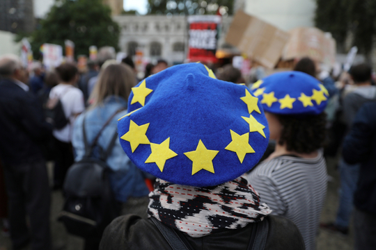 Anti-Brexit protesters attend a demonstration outside the Houses of Parliament, in London